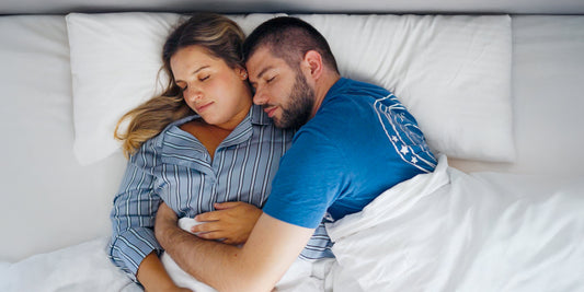 Couple sleeping peacefully after taking magnesium glycinate for better rest and relaxation
