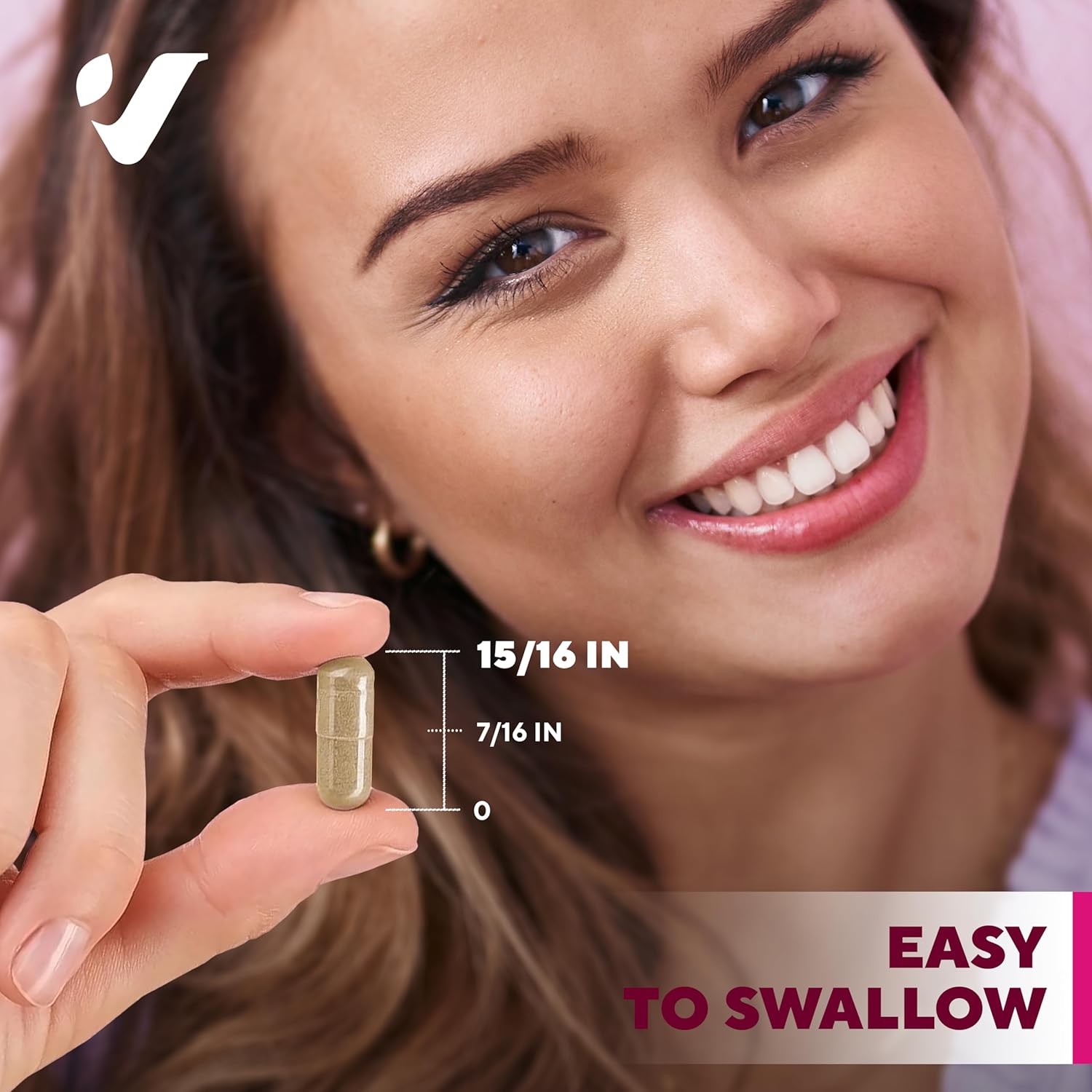  Woman holding VitaUp Shatavari supplement pill, smiling and enjoying the outdoors.