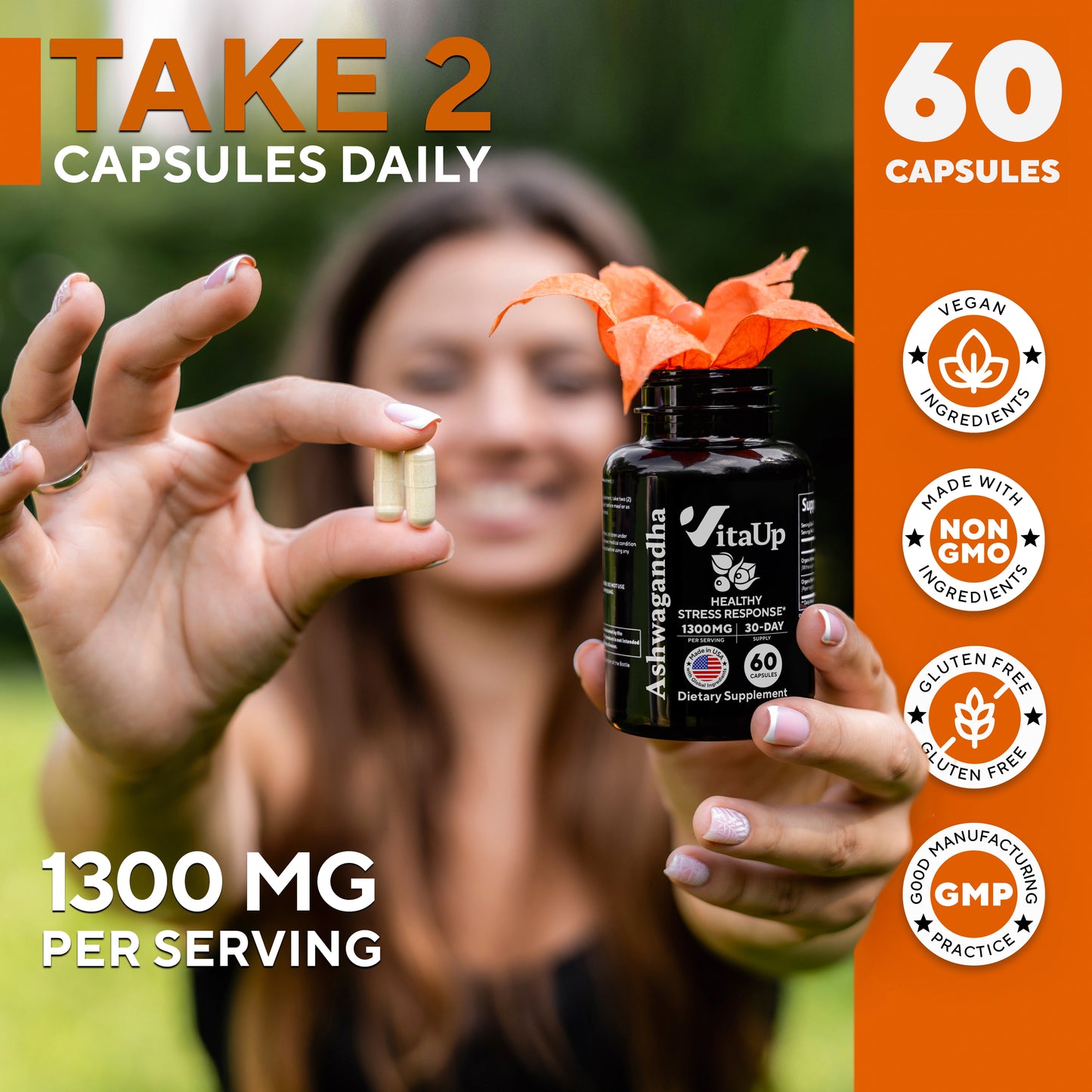 Woman smiling outdoors holding VitaUp Ashwagandha supplement and showing daily dose of two capsules.